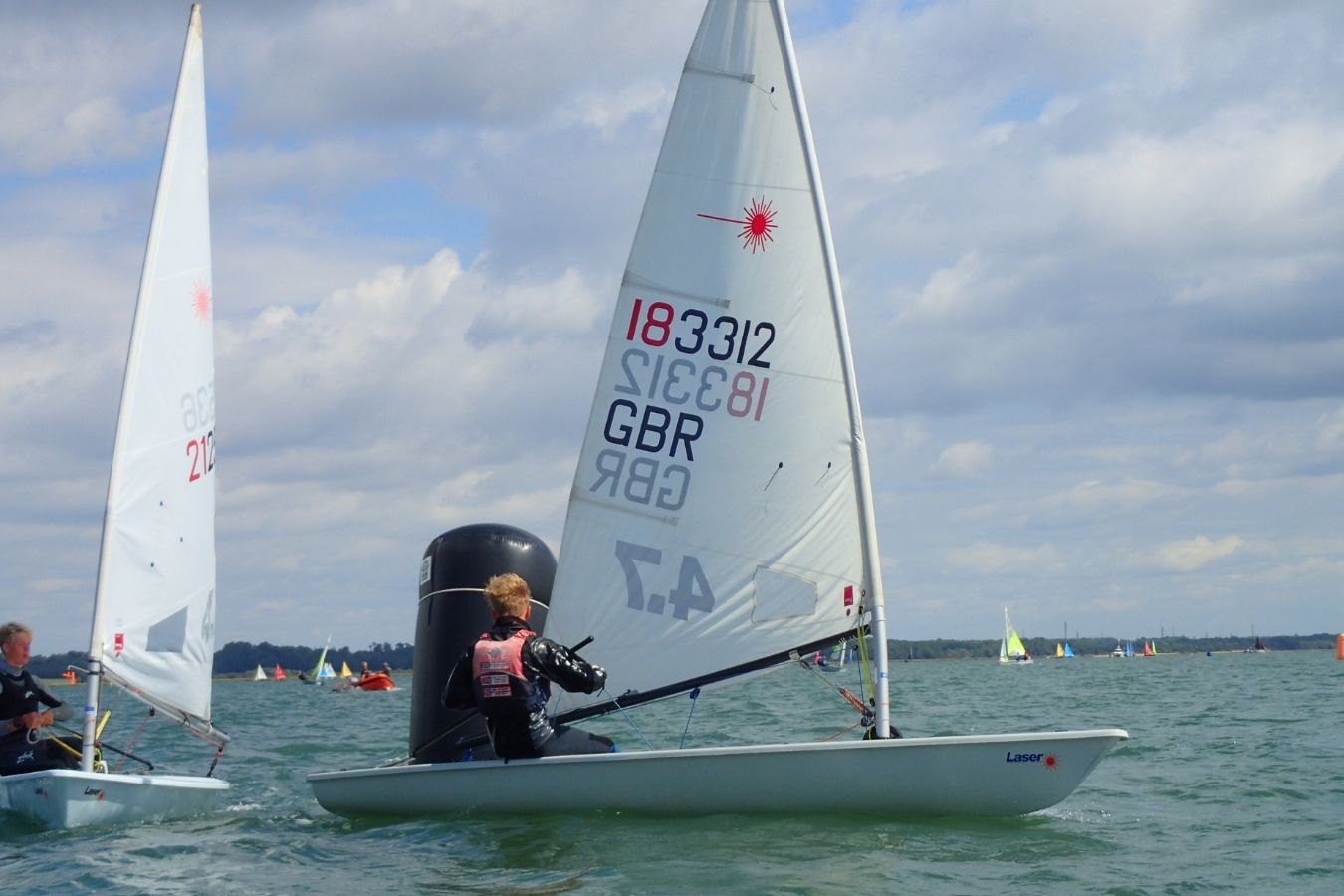 Laser class dinghy sailing at the Royal Lymington Yacht Club Royal